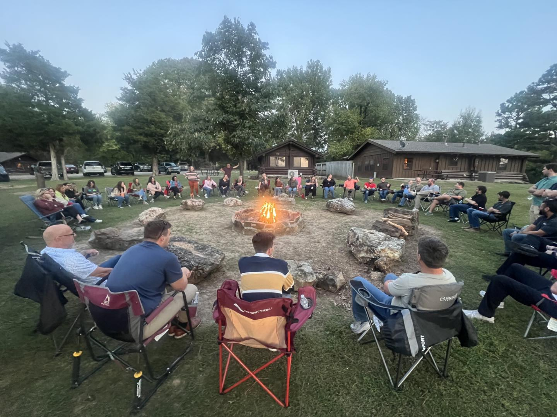 Leadership Paragould class sitting around a campfire