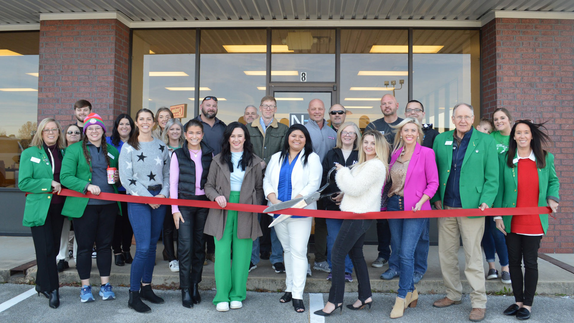 A new business hosting a ribbon cutting!