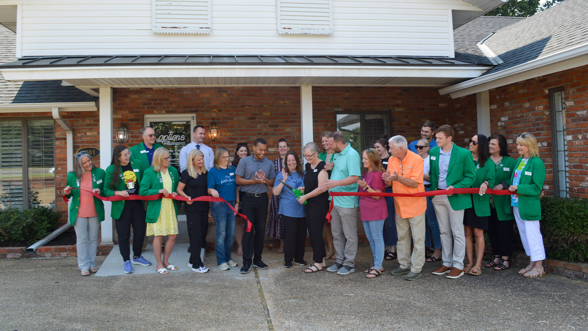 A new business hosting a ribbon cutting!