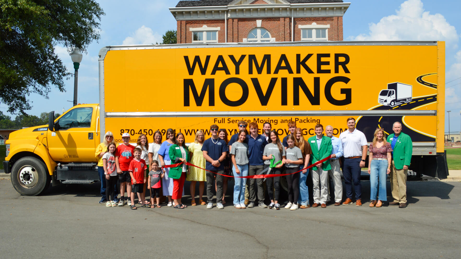Waymaker Moving gets a ribbon cutting in front of their moving truck