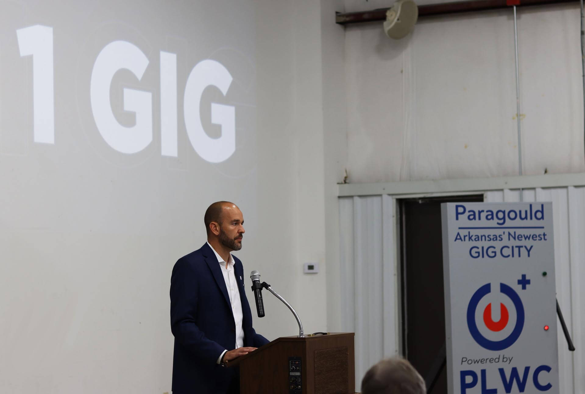 Josh Agee speech man speaks at podium